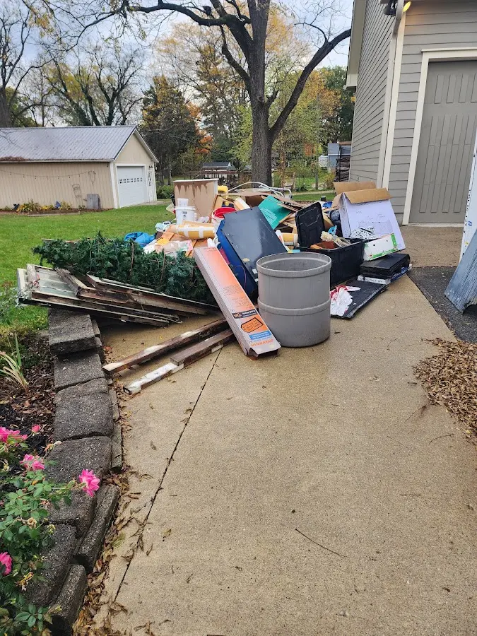 Dumpster being loaded with debris for 30 Yard Dumpster Rental in Point Pleasant